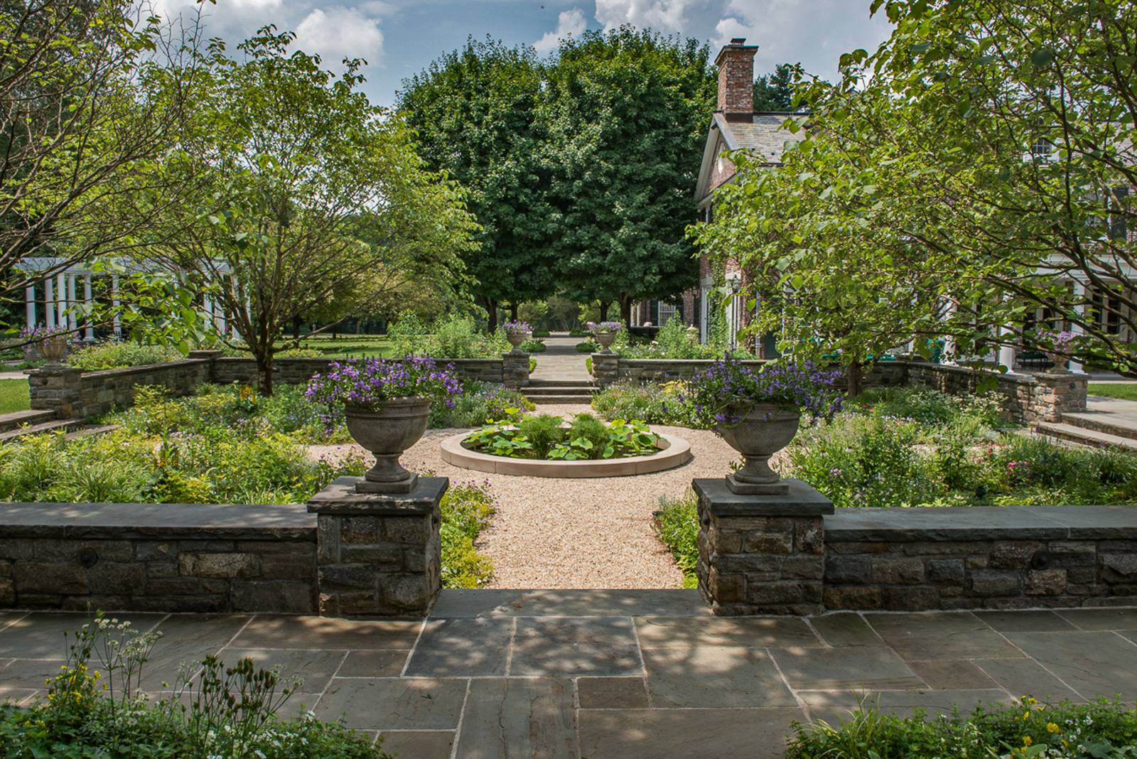 Urns on stone piers above the sunken garden